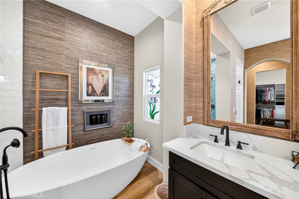 16375 Ory Circle Riverside, CA 92503 - Photo 29 of 51 a bathroom with a tub sink and mirror