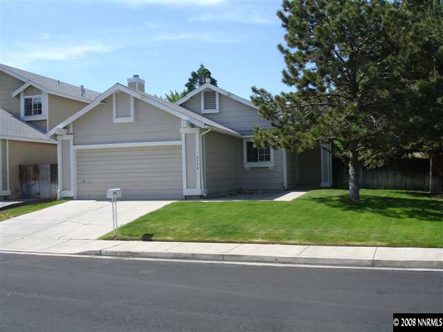 4348 Pescado Way Reno, NV 89502 - Photo 1 of 9 front view of a house with a yard