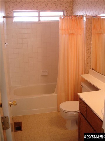 4348 Pescado Way Reno, NV 89502 - Photo 7 of 9 a bathroom with a toilet a sink and shower