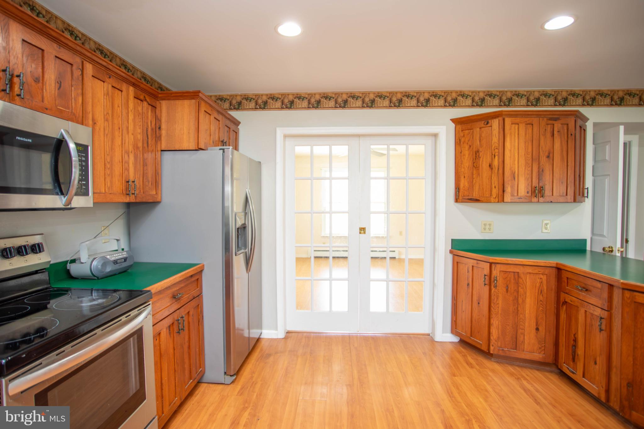 161 Coyote Run Mathias, WV 26812 - Photo 21 of 88 Warm wood tones in a cozy kitchen.