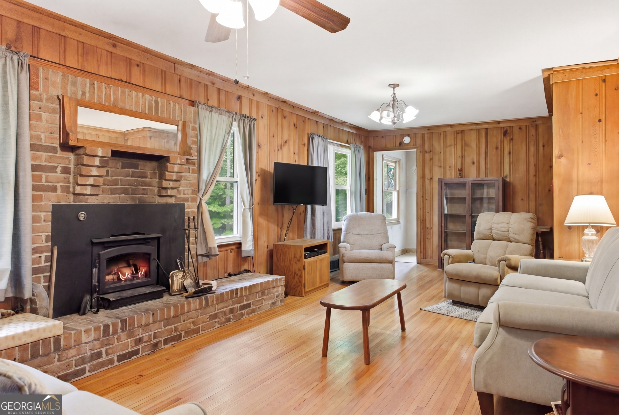 169 Pinecrest Road North Toccoa, GA 30577 - Photo 11 of 55 a living room with furniture a flat screen tv and a fireplace
