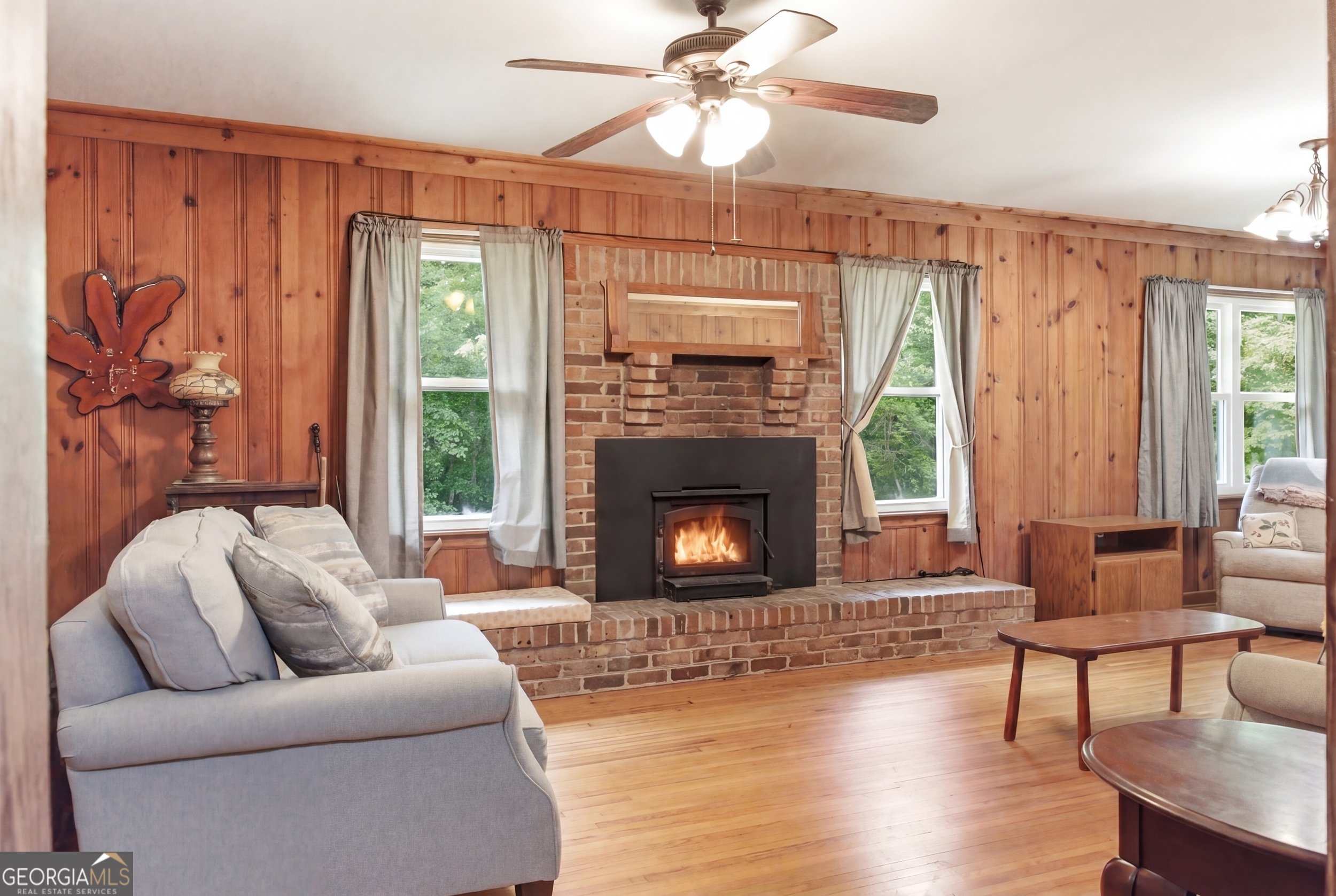 169 Pinecrest Road North Toccoa, GA 30577 - Photo 12 of 55 a living room with furniture and a fireplace