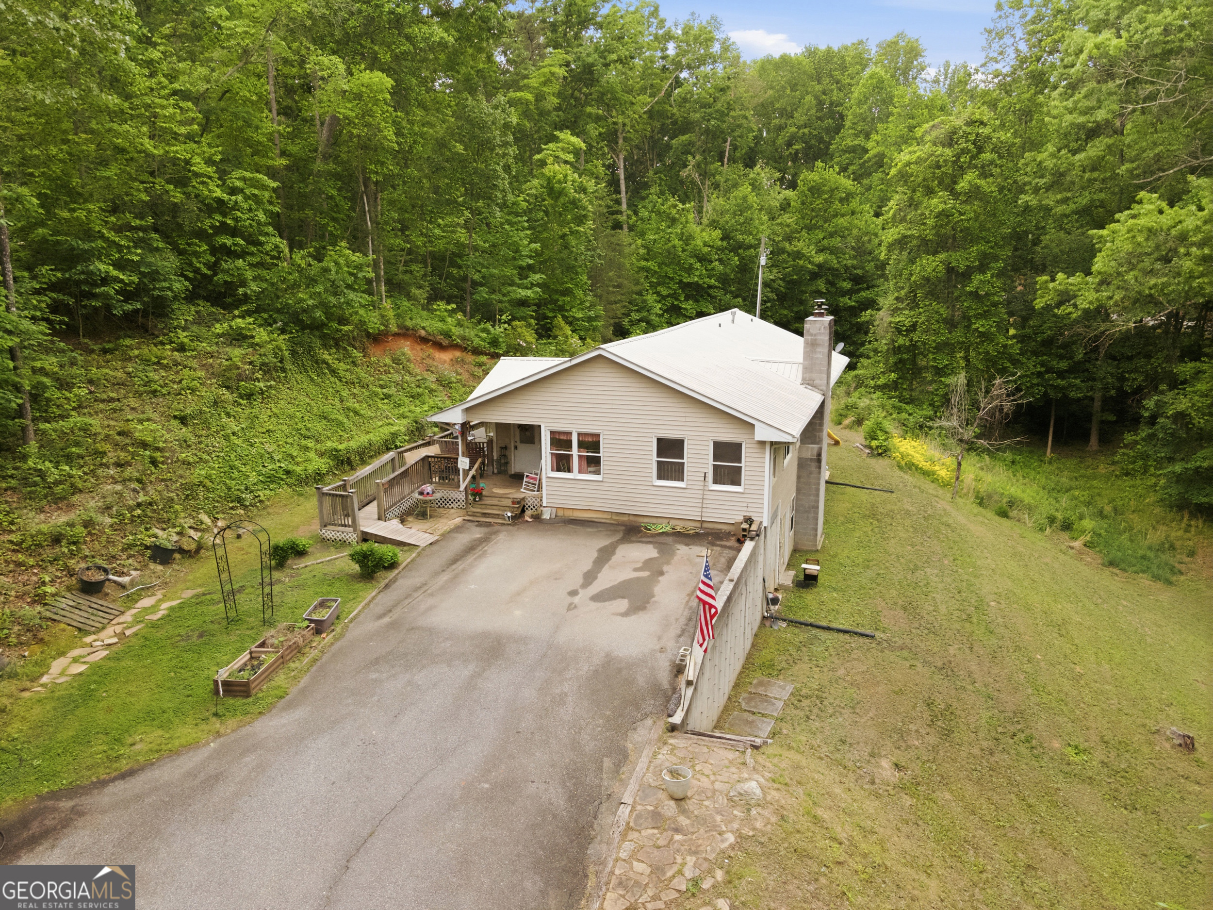 169 Pinecrest Road North Toccoa, GA 30577 - Photo 49 of 55 a aerial view of a house next to a yard with large trees