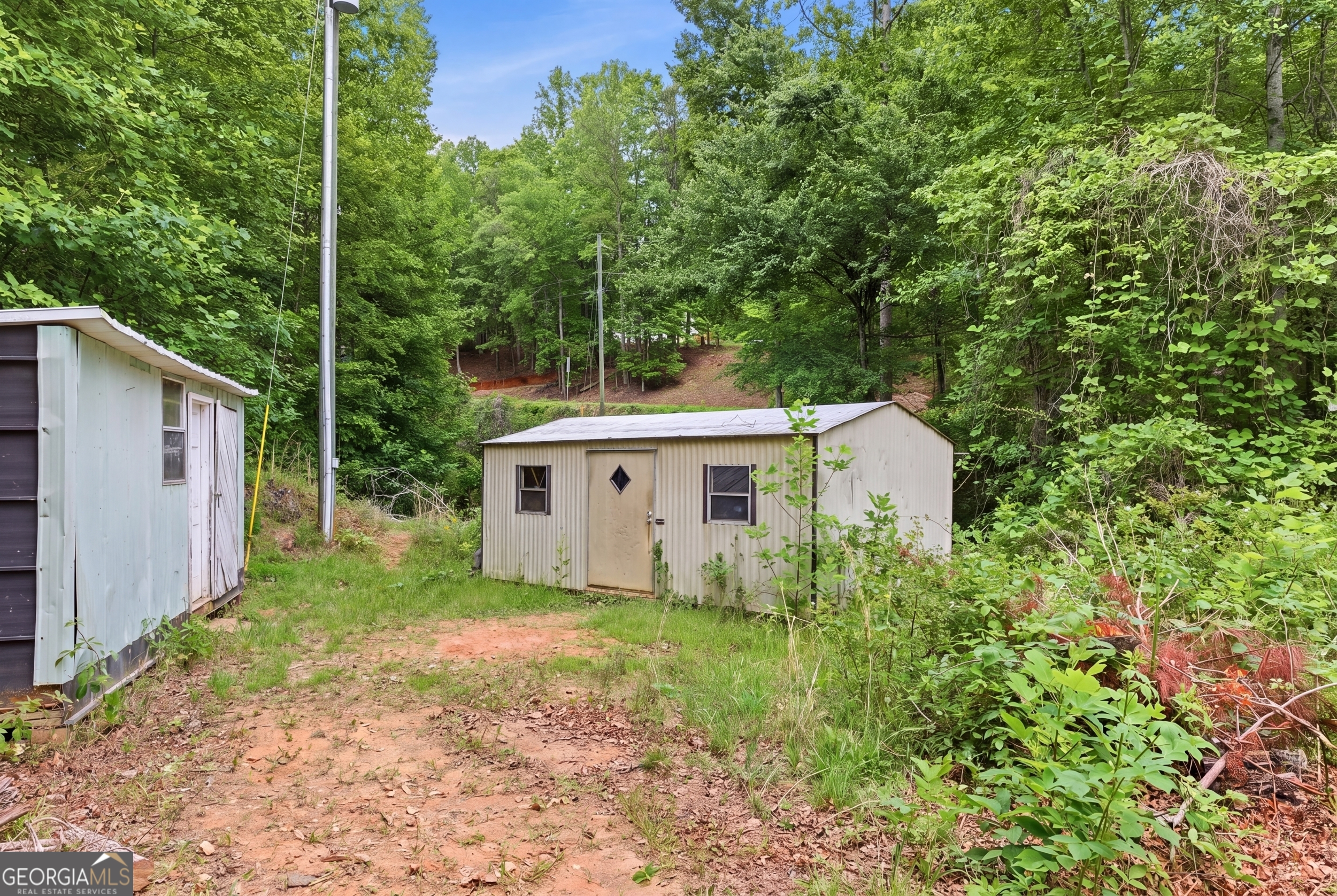 169 Pinecrest Road North Toccoa, GA 30577 - Photo 53 of 55 a view of a house with yard and a garden