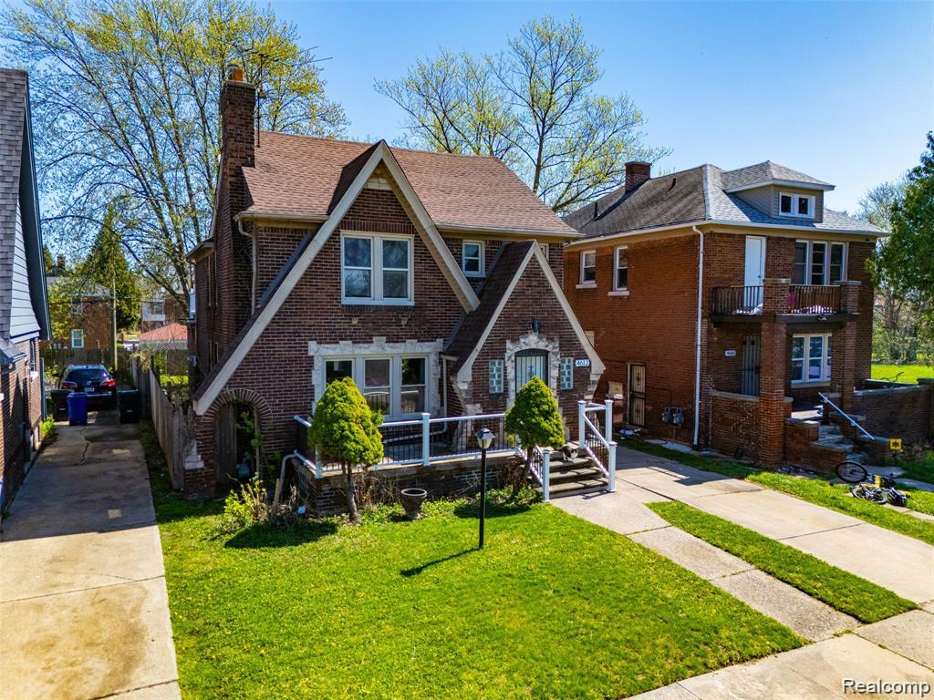 4612 Balfour Road Detroit, MI 48224 - Photo 20 of 20 Brick exterior home with a gabled roofline and prominent chimney