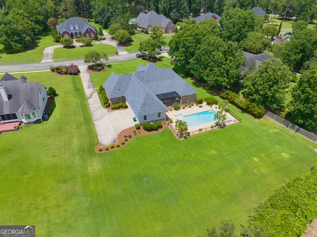 a view of a house with a yard porch and sitting area