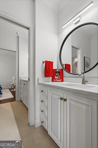 a bathroom with a sink toilet and mirror