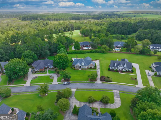 an aerial view of a house with a garden