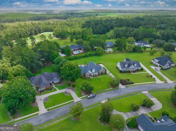 an aerial view of a house with outdoor space swimming pool and outdoor seating
