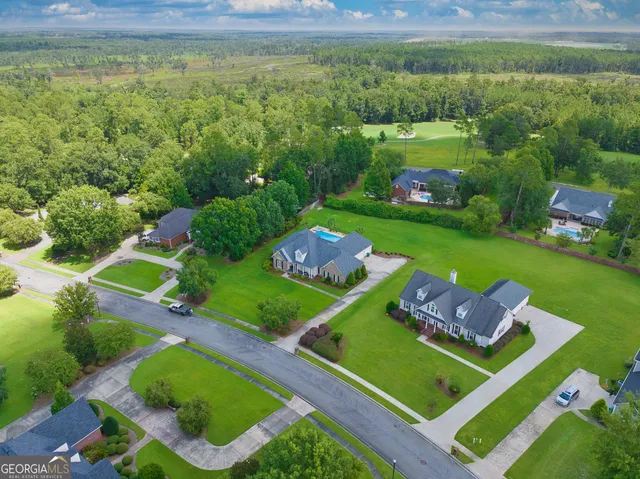 an aerial view of a house with a garden