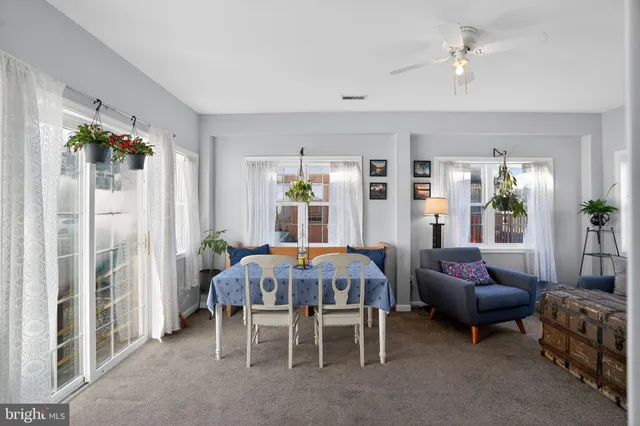 a view of a dining room with furniture window and outside view