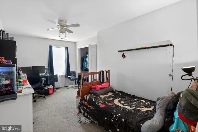 a bedroom with furniture and a window