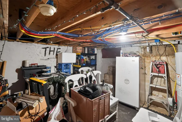 a room with lots of appliances and cabinets