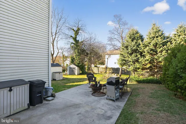 a view of a patio with table and chairs and potted plants