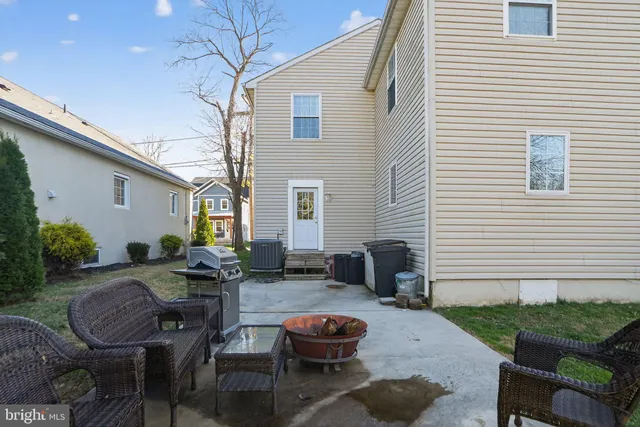 a backyard of a house with outdoor seating