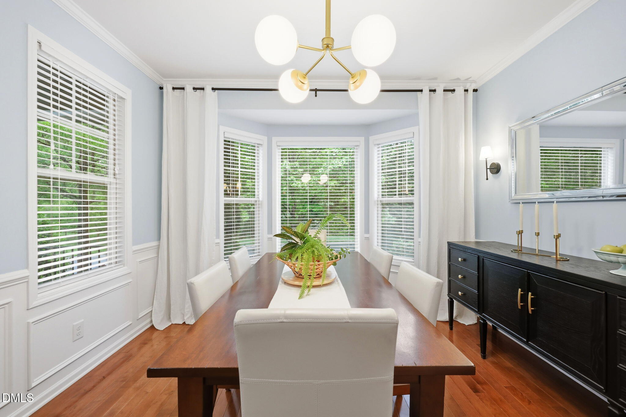 162 Gathering Place Durham, NC 27713 - Photo 16 of 52 a view of a dining room with furniture a chandelier and wooden floor