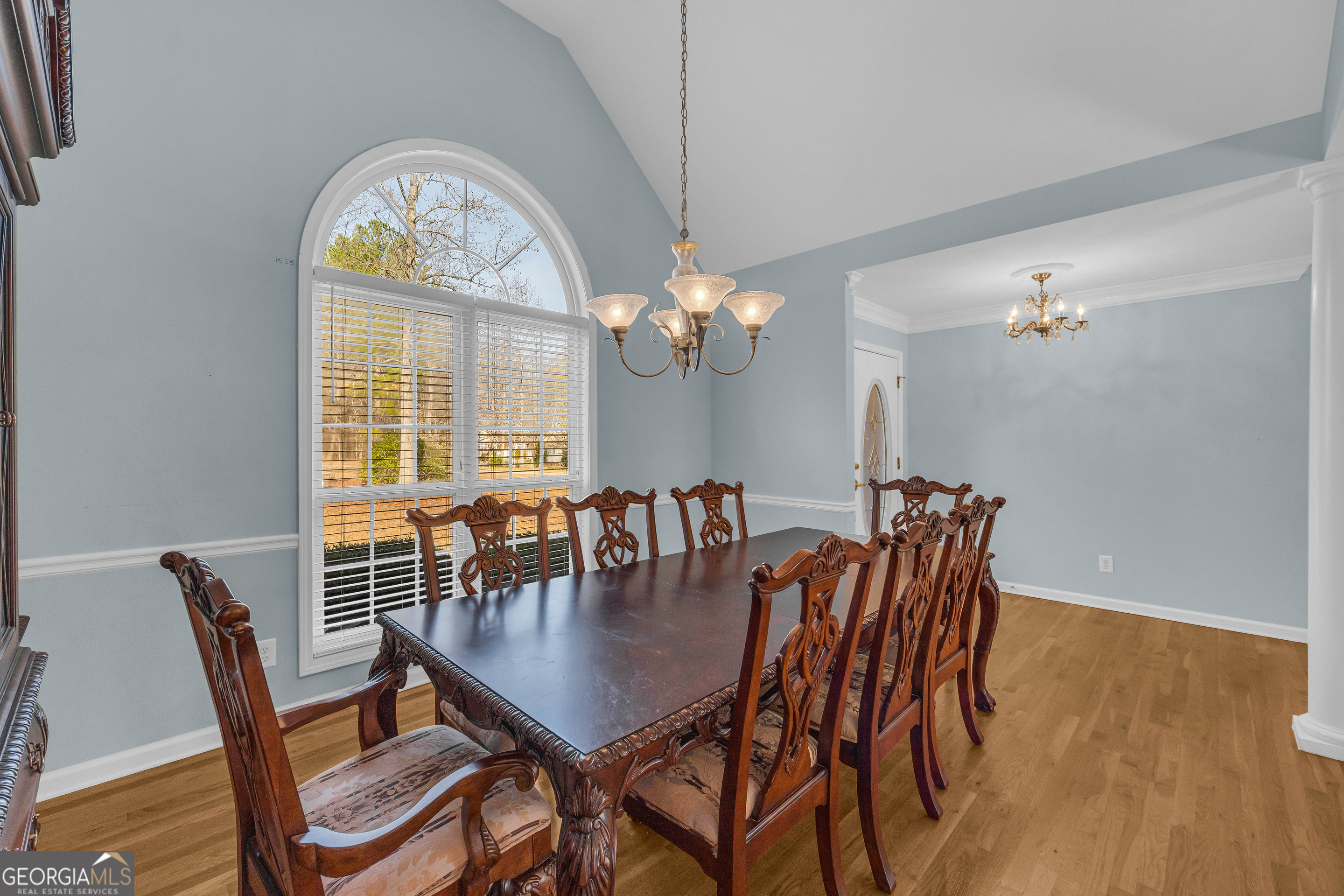 114 River Bluff Hoschton, GA 30548 - Photo 15 of 72 a dining room with furniture a chandelier and wooden floor