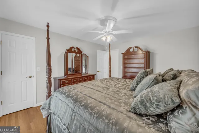 a bathroom with a granite countertop sink mirror and a bathtub