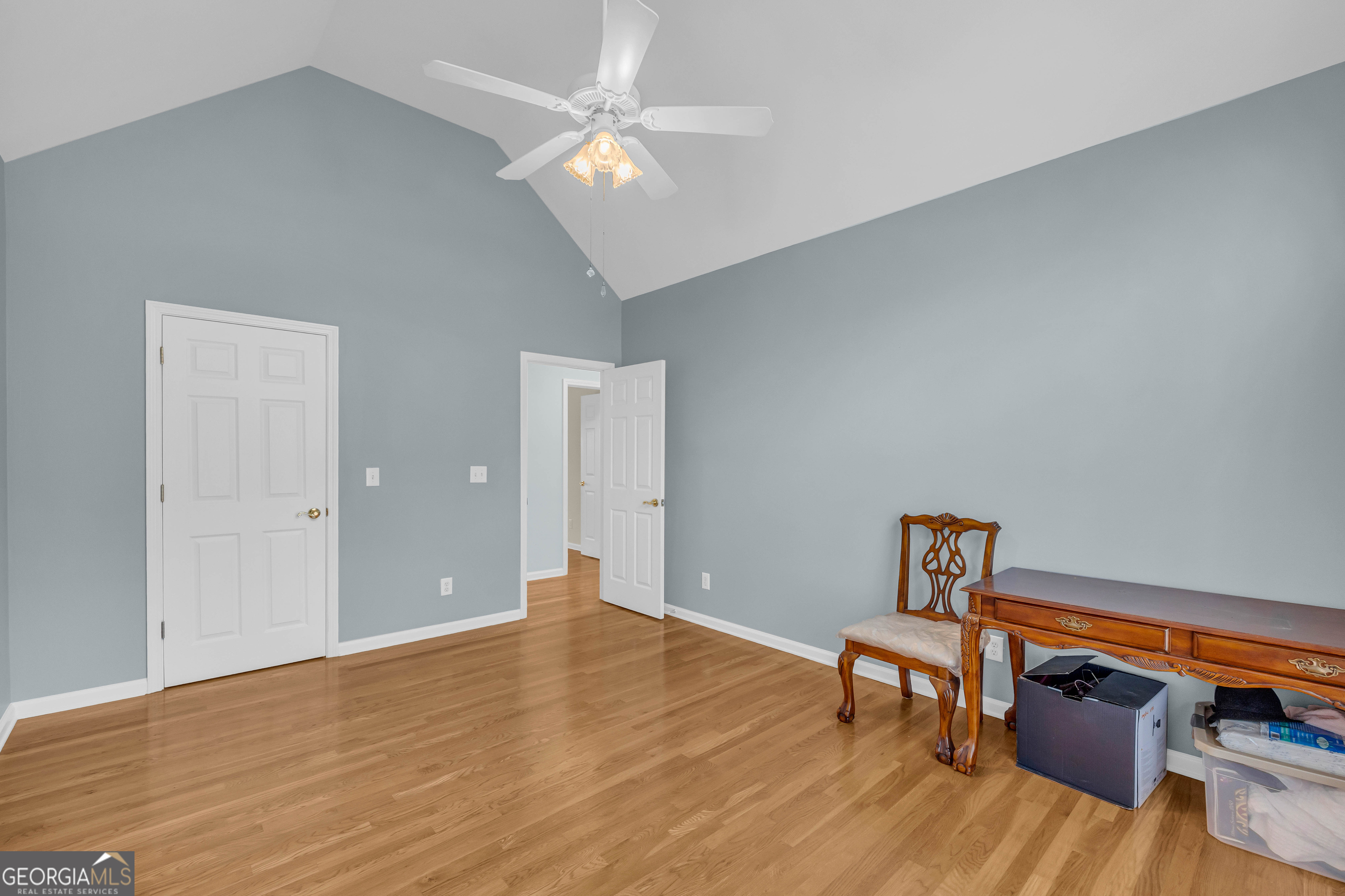 114 River Bluff Hoschton, GA 30548 - Photo 22 of 72 a view of workspace room with wooden floor and fan