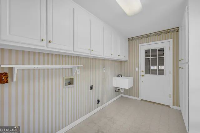 a bathroom with a granite countertop toilet a sink and a mirror