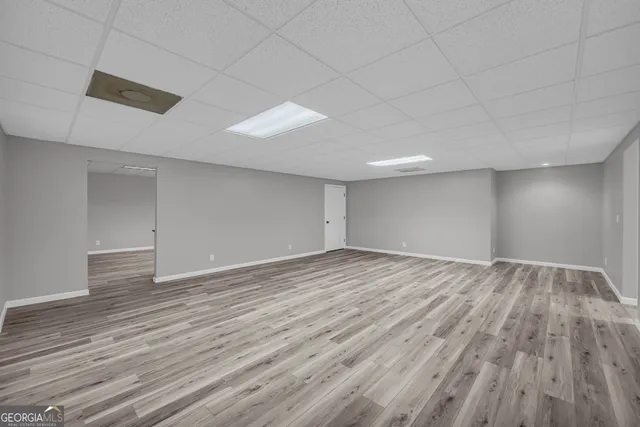 a view of a kitchen with granite countertop cabinets and wooden floor