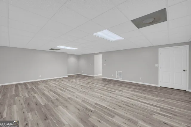 a kitchen with granite countertop white cabinets stainless steel appliances and sink