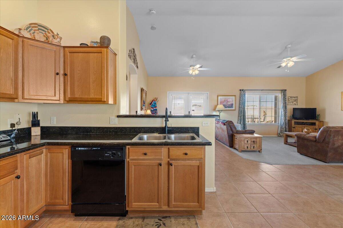 14234 South Capistrano Road Arizona City, AZ 85123 - Photo 11 of 42 a kitchen with a sink and cabinets