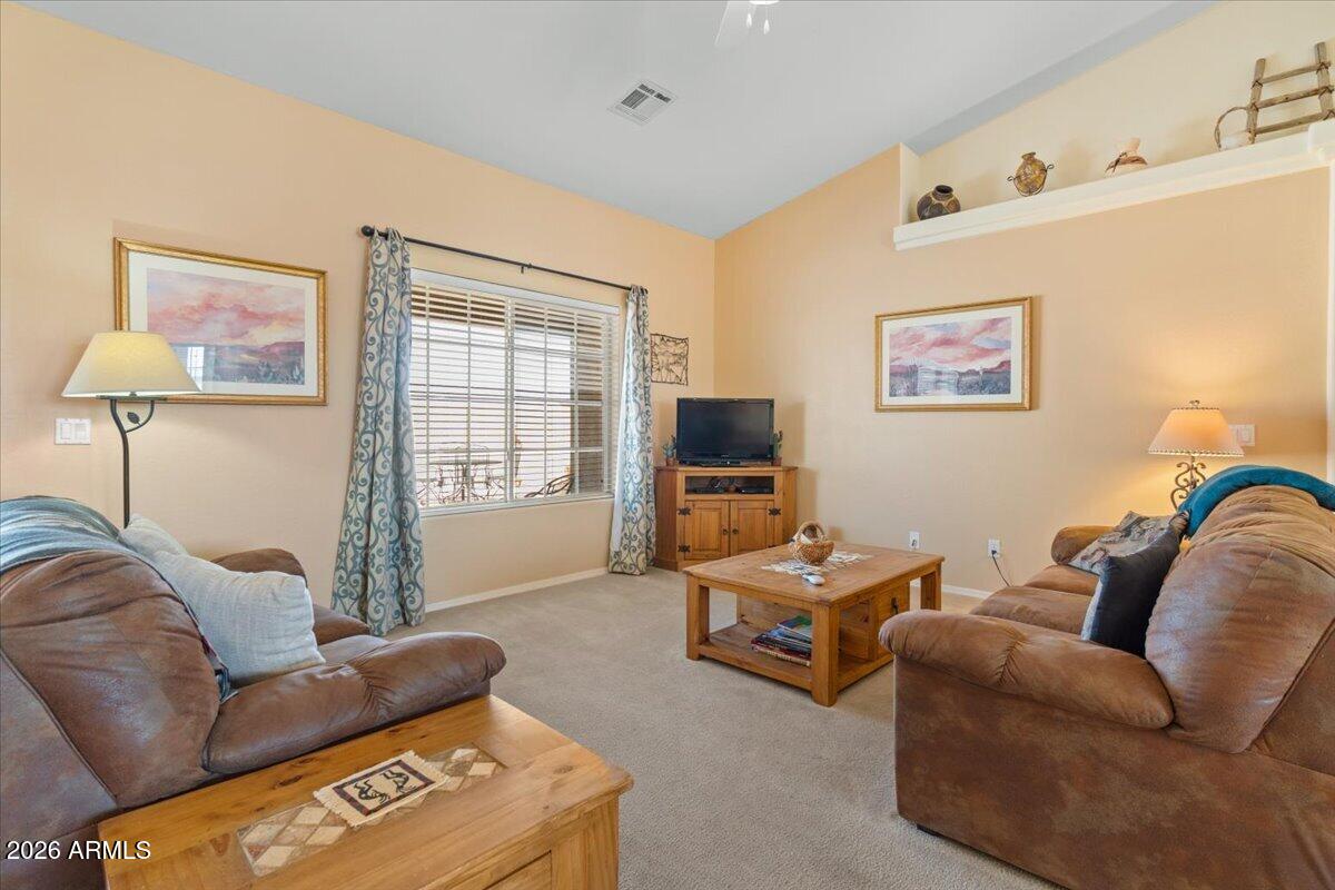 14234 South Capistrano Road Arizona City, AZ 85123 - Photo 13 of 42 a living room with furniture and a flat screen tv