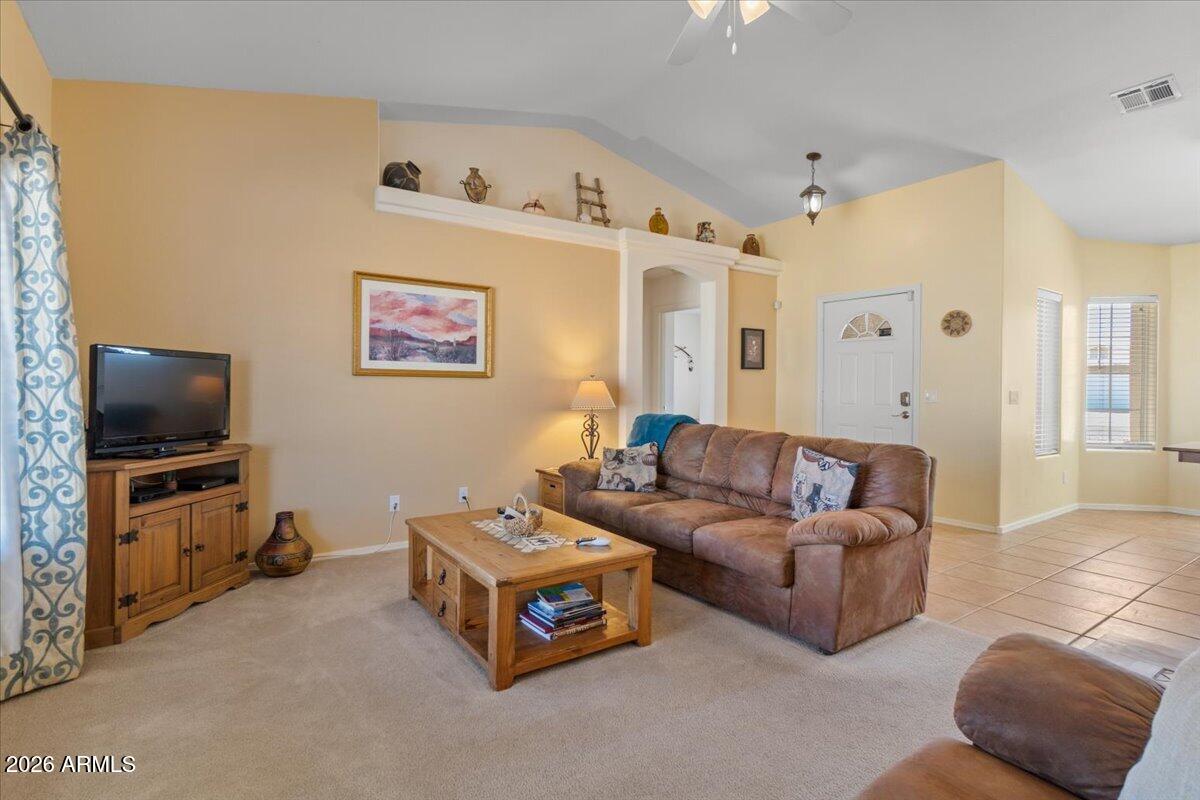 14234 South Capistrano Road Arizona City, AZ 85123 - Photo 14 of 42 a living room with furniture and a flat screen tv