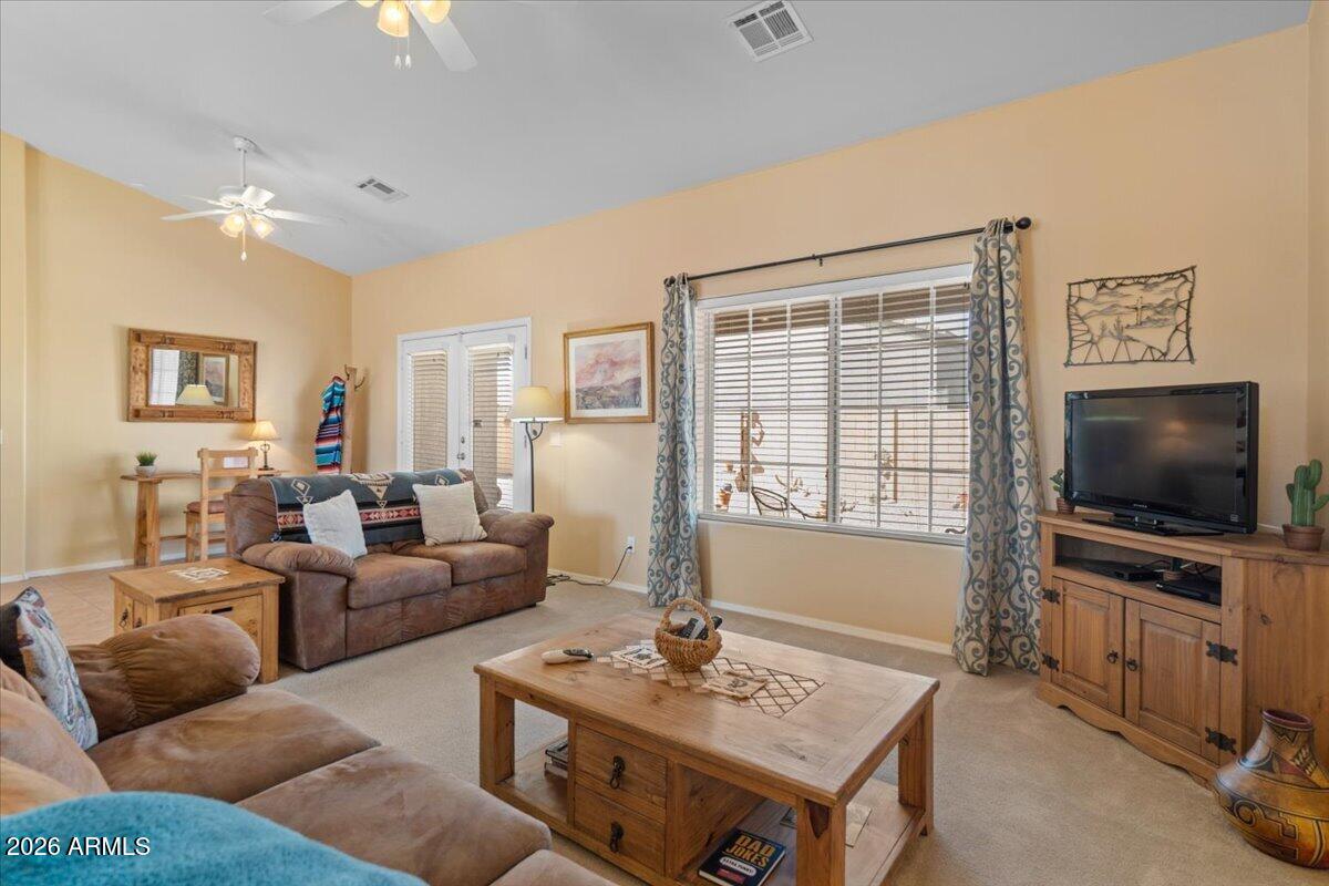 14234 South Capistrano Road Arizona City, AZ 85123 - Photo 15 of 42 a living room with furniture and a flat screen tv