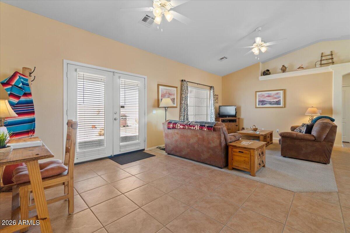 14234 South Capistrano Road Arizona City, AZ 85123 - Photo 17 of 42 a living room with furniture and a flat screen tv