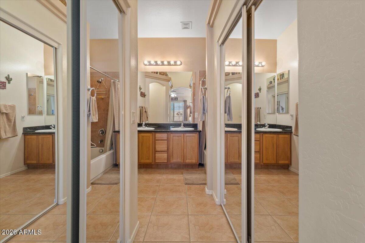 14234 South Capistrano Road Arizona City, AZ 85123 - Photo 21 of 42 a view of a kitchen with a refrigerator and a stove top oven