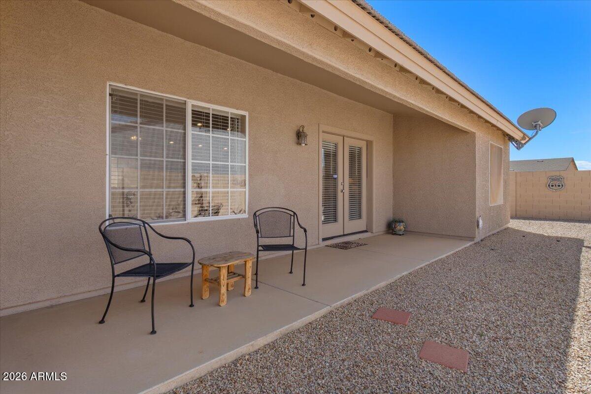 14234 South Capistrano Road Arizona City, AZ 85123 - Photo 31 of 42 a balcony with table and chairs