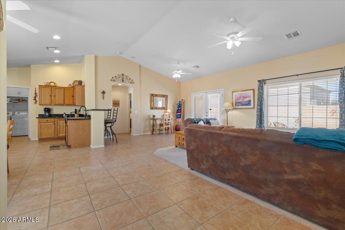 14234 South Capistrano Road Arizona City, AZ 85123 - Photo 3 of 42 a living room with furniture and a flat screen tv