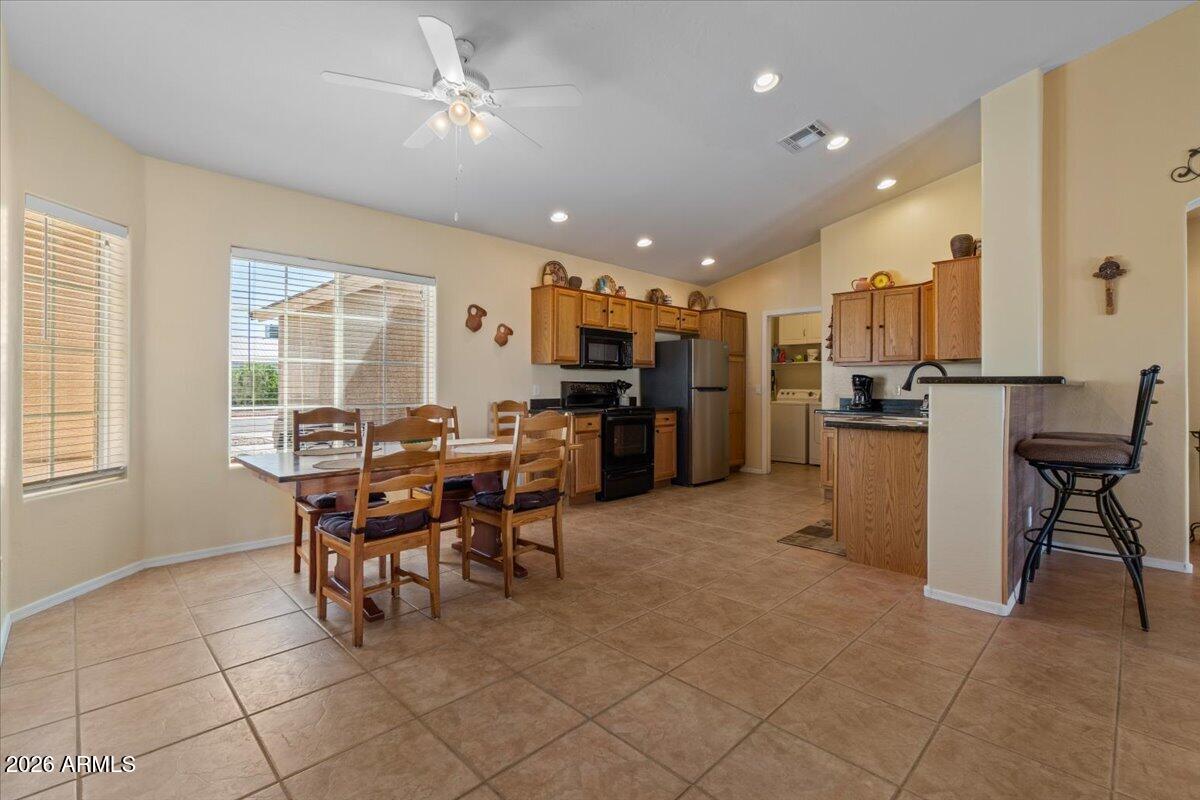 14234 South Capistrano Road Arizona City, AZ 85123 - Photo 5 of 42 a view of a dining room with furniture