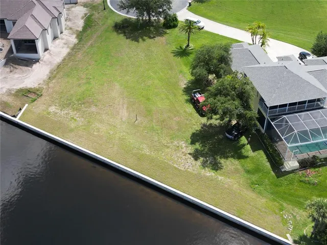 an aerial view of a house with a lake view