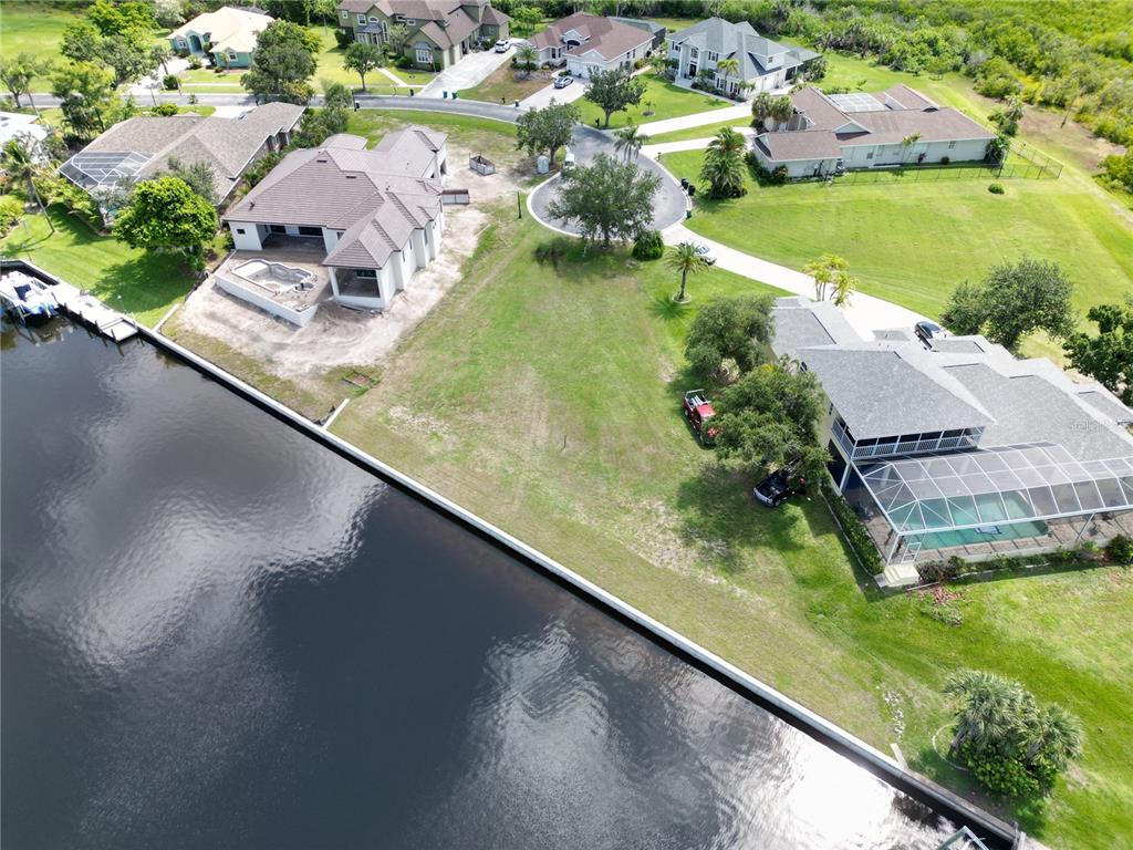 4361 Point Court Port Charlotte, FL 33948 - Photo 19 of 26 an aerial view of a house with a yard and lake view