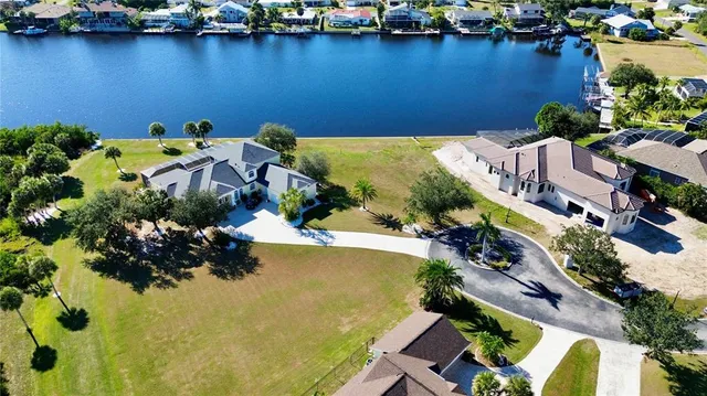 an aerial view of a house with a yard