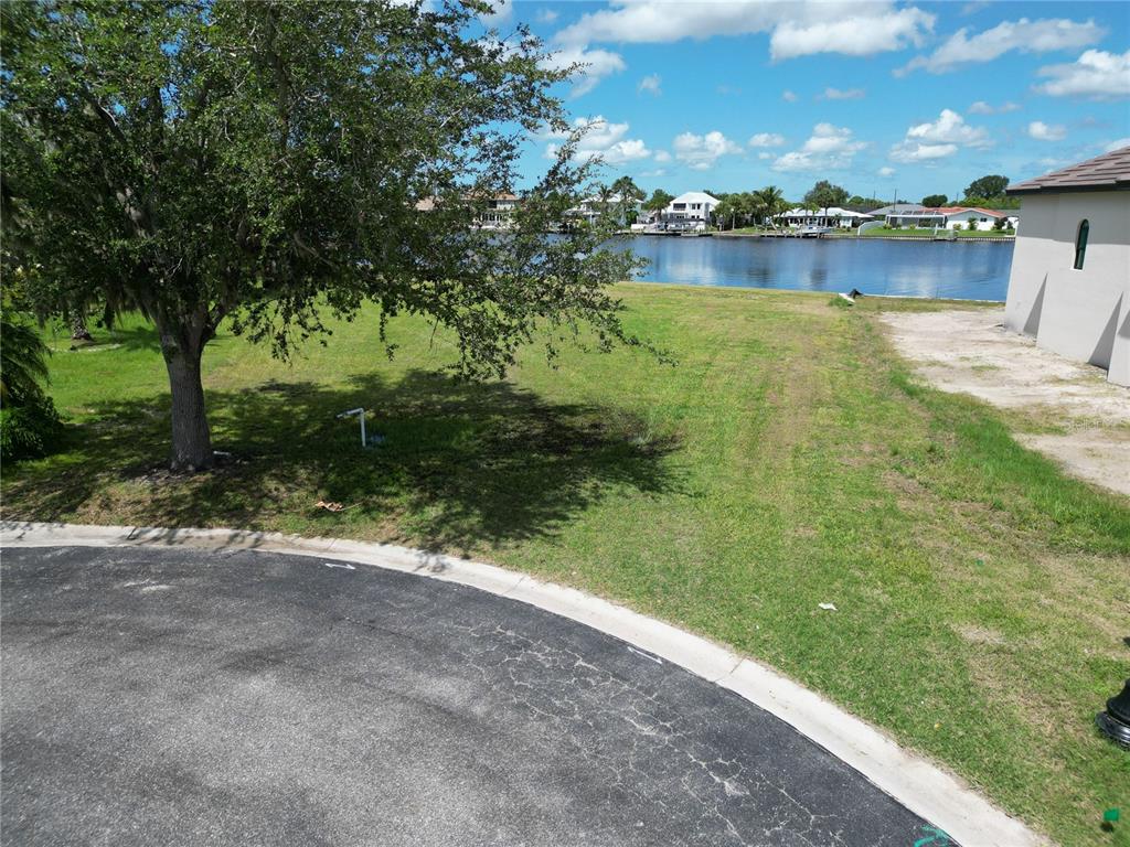 4361 Point Court Port Charlotte, FL 33948 - Photo 23 of 26 a view of a lake from a yard