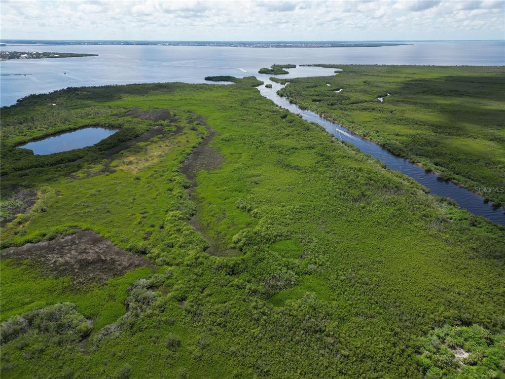 4361 Point Court Port Charlotte, FL 33948 - Photo 26 of 26 a view of a golf course with a lake