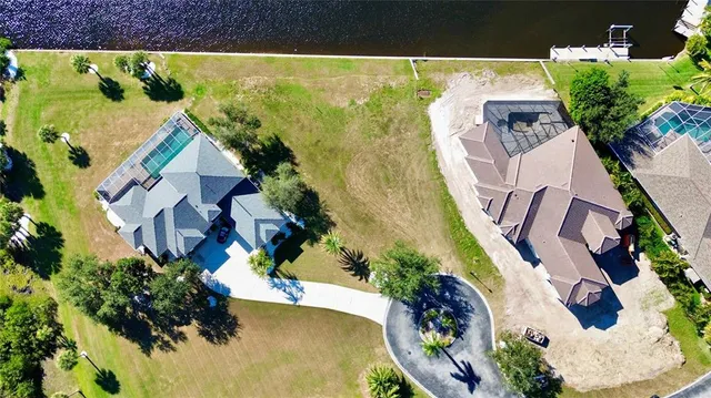 an aerial view of a house with a swimming pool