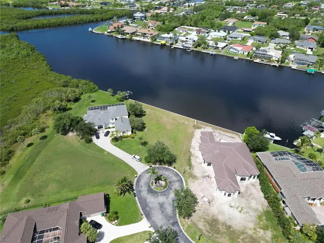 an aerial view of a house with a lake view