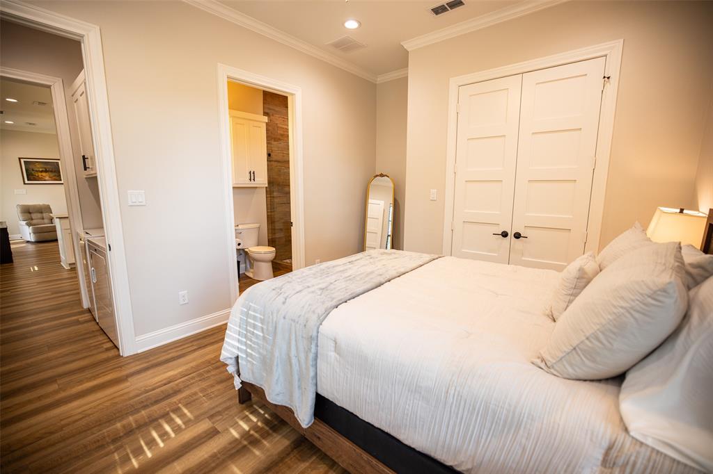 450 Northeast Loop 7 Athens, TX 75751 - Photo 23 of 38 a bedroom with a bed and wooden floor