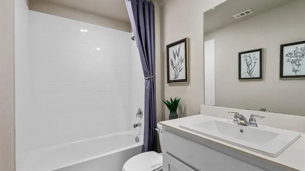 a bedroom with furniture and a book shelf