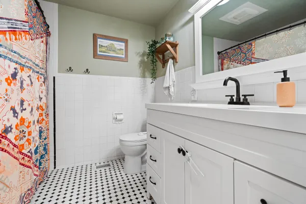 a bathroom with a sink and a toilet