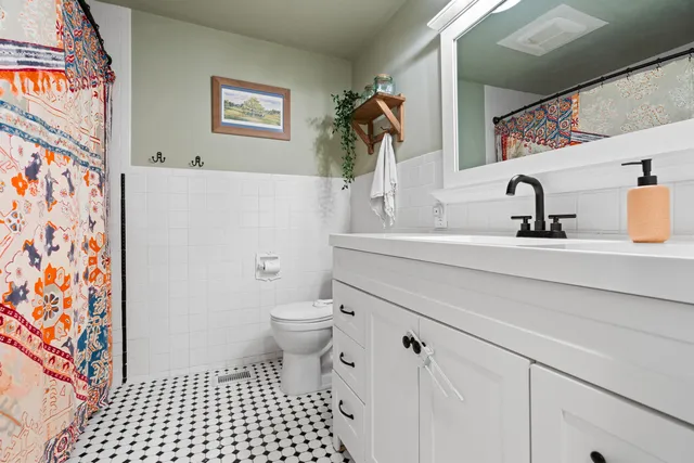a bathroom with a sink and a toilet