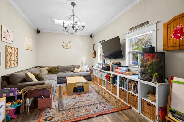 a living room with lots of furniture and a flat screen tv