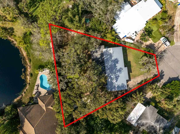 an aerial view of a houses with outdoor space