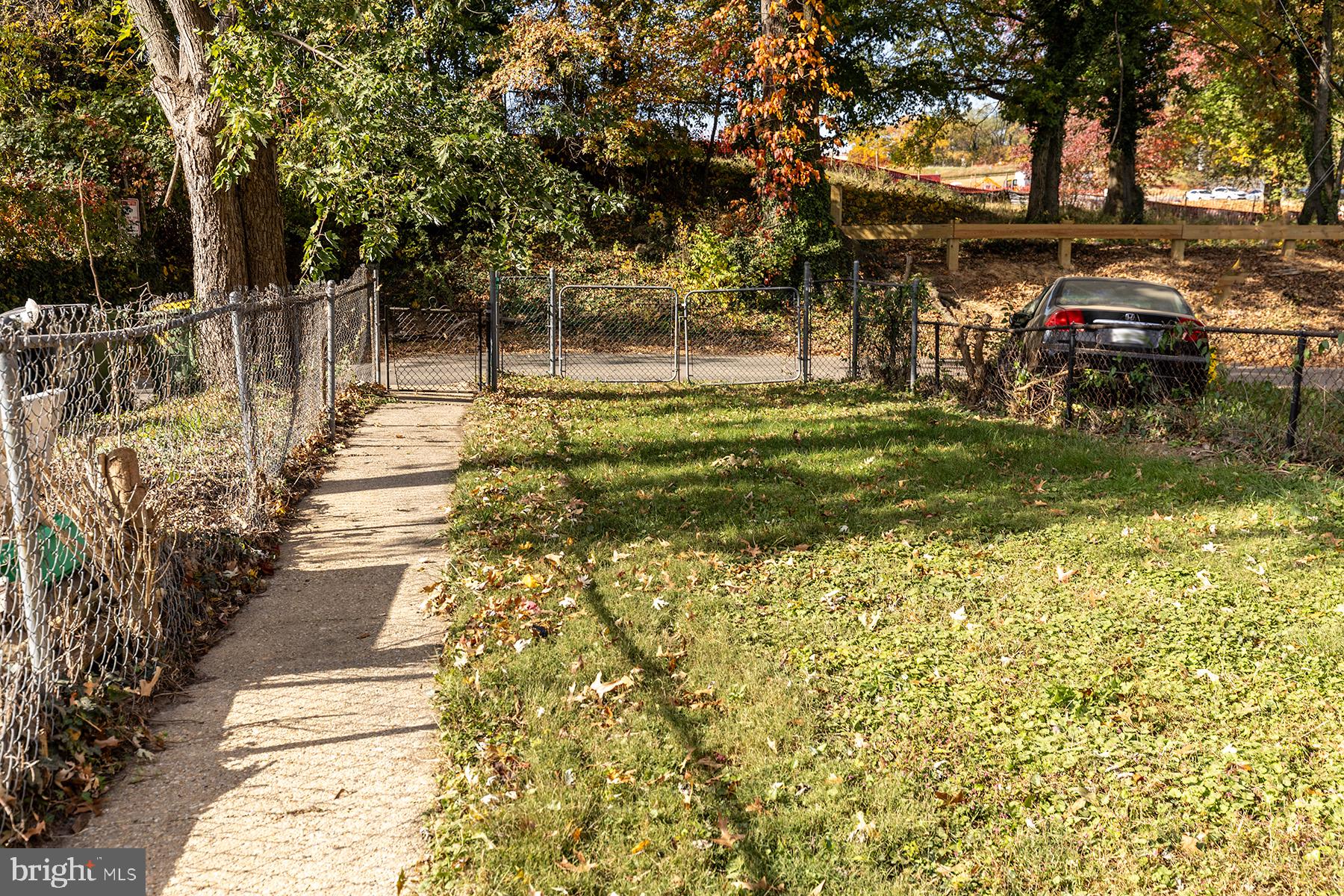 5318 Brookwood Road Baltimore, MD 21225 - Photo 29 of 34 Fenced backyard with alley to school