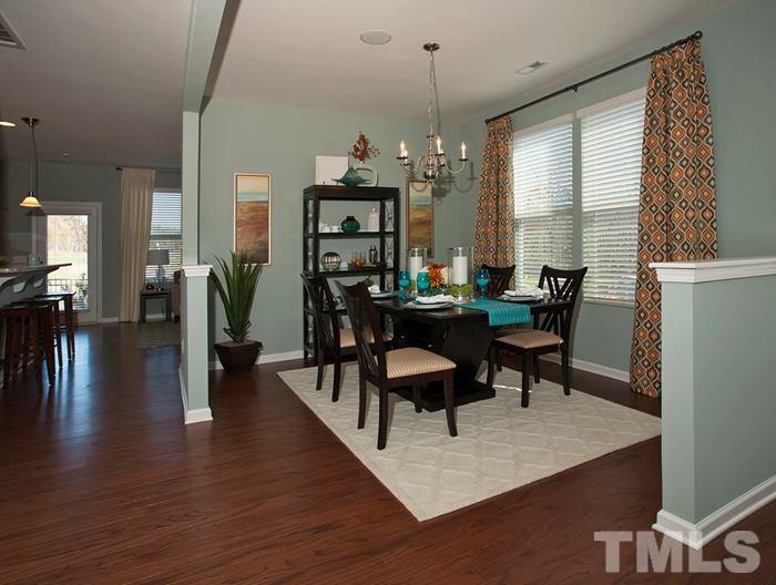 3003 Bluegrove Road Raleigh, NC 27610 - Photo 3 of 25 a view of a dining room with furniture window and wooden floor